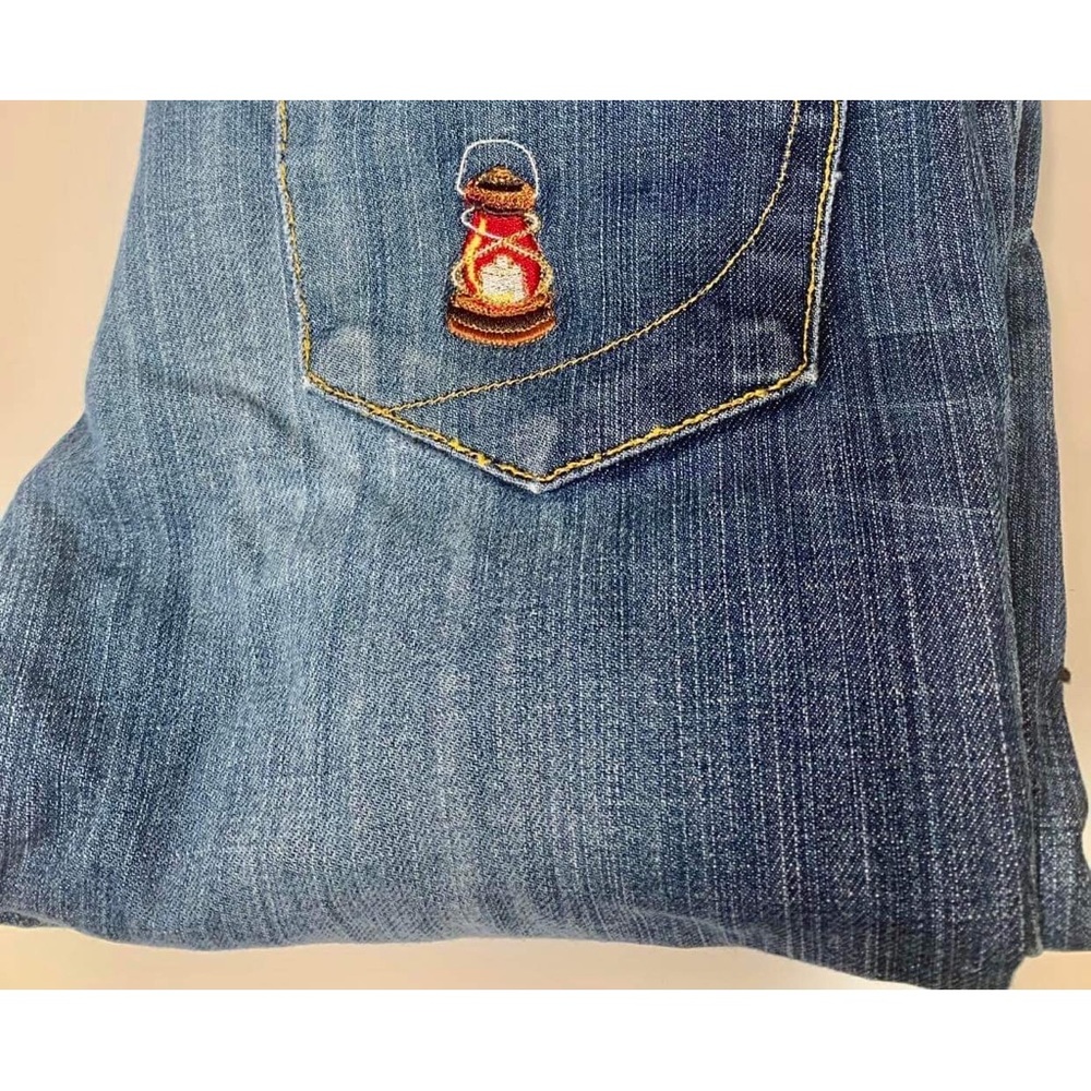 Upcycled, Paper, Denim and Cloth jeans. With embroidered lantern.